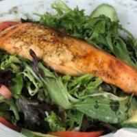 Grilled Salmon Salad · Grilled salmon served atop fresh greens, tomato, cucumber, & red onions.