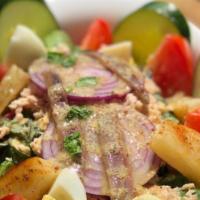 Nicoise · Mixed greens, white tuna, tomato, potato, red onion, cucumber, eggs, & anchovies in nicoise ...
