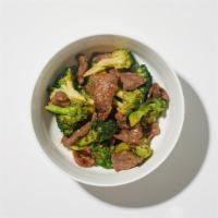 Beef And Broccoli · Beef sautéed with broccoli, white onions, and carrots in a light garlic sauce.