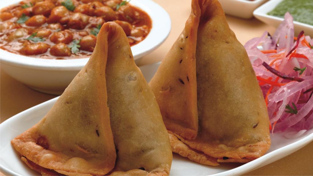 Vegan Plain Samosa (2) · Two home made samosa served with hot and sweet dip.