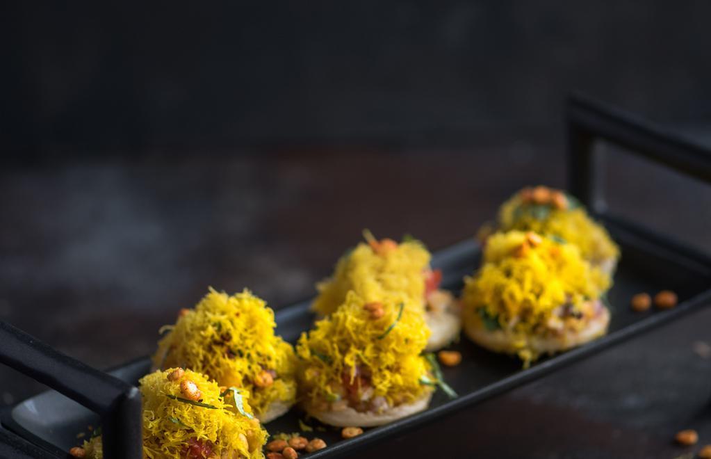 Sev	Batata	Poori · Flat crisps topped with potato, various spices and sauces.