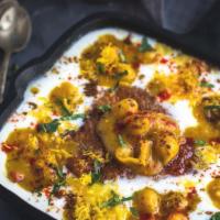 Samosa	Chaat · Home made samosa topped with various spices, sauces and yoghurt.