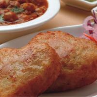 Cholay	Tikki		 · Potato croquette served with chickpea curry. (2)