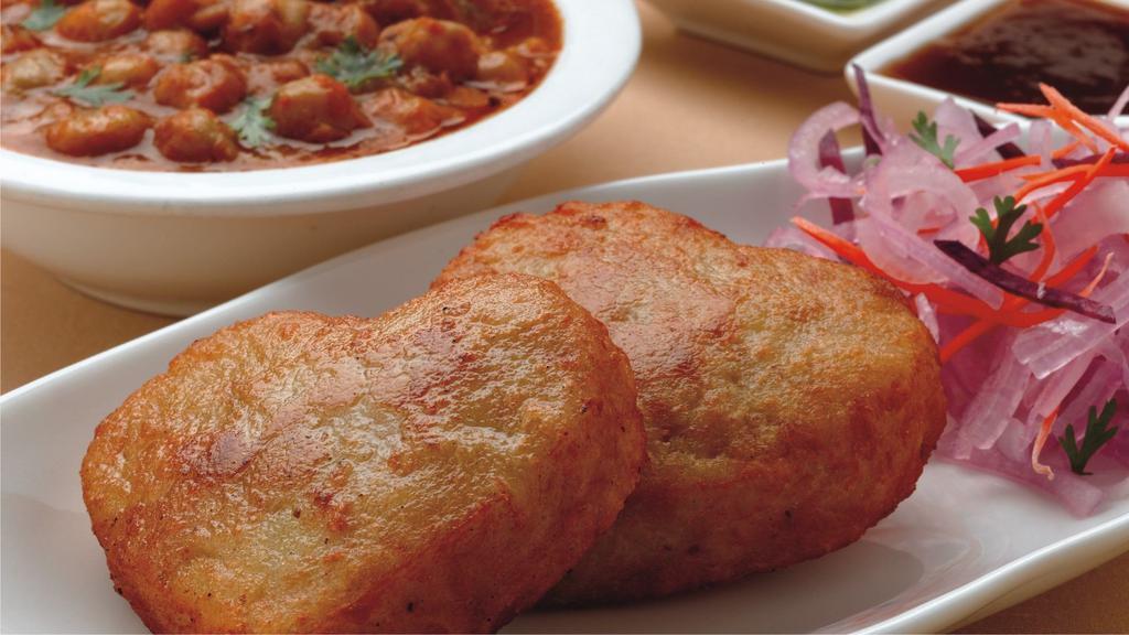 Cholay	Tikki		 · Potato croquette served with chickpea curry. (2)