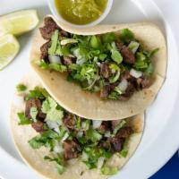 Steak Taco · Homemade marinated steak, white onions, cilantro. Salsa Verde and lime on the side. (1 Taco )