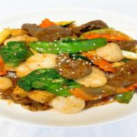 Beef With Scallop · Beef and scallop with mixed vegetables in special brown sauce. Served with jasmine rice or b...