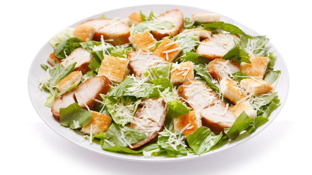 Chicken Cutlet Caesar Salad · Chicken cutlet, romaine, tomatoes, croutons, Parmesan cheese, and creamy Caesar.