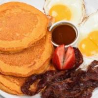 Two Pancakes Platter · Served with eggs, cheese, and choice of bacon or sausage.