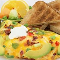 Guacamole Omelette · Guacamole, Onions, Bacon, Sour Cream, Cheddar Cheese & Tortilla Chips. Served With Home Frie...