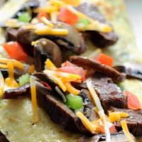 Marinated Portobello Mushroom Omelette · Portobello mushrooms with your choice of Brie or goat cheese. Served with chopped salad with...