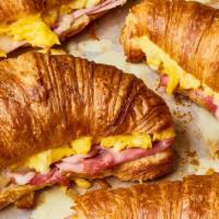 Roasted Ham , Swiss & Egg Croissant · Grilled Ham, Scrambled Eggs & Melted Swiss Cheese. Served on a  Grilled Croissant.