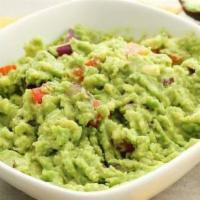 Guacamole Dip · Served with warm corn tortilla chips and a side of sour cream and homemade salsa.