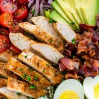 California Cobb Salad · Grilled Chicken, blue cheese, cherry tomatoes, smoked bacon, corn, red onions, hard boiled  ...