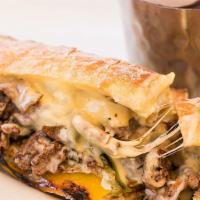 California Cheese Steak · Thinly sliced grilled steak, sautéed mushroom, grilles onions, peppers, swiss & cheddar chee...
