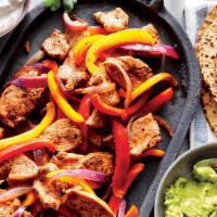 Chicken Fajitas · Marinated strips of chicken sautéed with onions, peppers and mushrooms. Served with homemade...