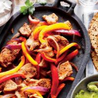 Steak Fajitas  · Marinated strips of chicken sautéed with onions, peppers and mushrooms. Served with homemade...