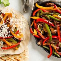 Vegetarian Fajitas · Sautéed mushrooms, onions, peppers, tomatoes, and broccoli, served with homemade black beans...