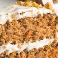 Carrot Cake · Deliciously Moist Layers Of Carrot Cake & Our Famous Cream Cheese Icing. Topped With Ice Cre...