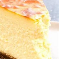 Classic New York Cheese Cake · Tall and creamy New York cheesecake. Served with vanilla bean whipped cream. Top it with ice...