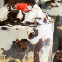 Jackson Hole Sundae · Layers of vanilla ice cream, hot fudge, chunks of chocolate fudge cake, fresh strawberries, ...