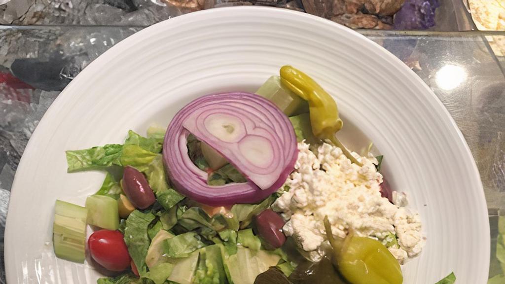 Greek Salad · Crisp Romaine, Cucumber, Feta Cheese, Tomatoes, Kalamata Olives, Red and Green Peppers, Olive Oil, Greek Vinaigrette.