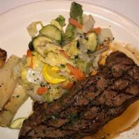 New York Strip Steak · Grilled Black Angus, Oven Roasted Lemon Potatoes, Fresh Vegetable Medley, Sherry-Soy Drizzle.