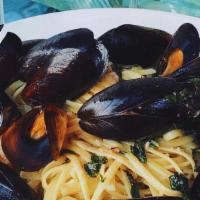 Mussels With Roasted Garlic Basil · Sautéed with extra virgin olive oil, crushed red pepper flakes, served over Capellini Pasta.