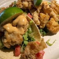 Fish Tacos With Avocado Lime Salsa And Chipotle Drizzle · Seasoned fried cod fillet with shredded lettuce, cilantro-avocado salsa in a warm soft corn ...