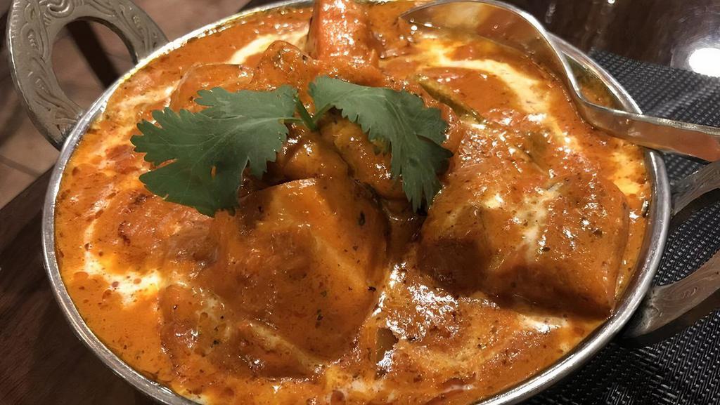 Chicken Tikka Masala · Most popular. The most popular Indian dish, cooked in mildly spiced tomato onion gravy with green peppers, onions, and fresh cilantro. Served with basmati rice.