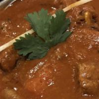 Lamb Rogan Josh · Lamb cubes cooked with onion, tomatoes and yogurt spiced with the chef's special mix and gar...