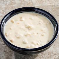 Bowl Of New England Clam Chowder · Our famous clam chowder, made with clams, potatoes, celery, onion & bacon.