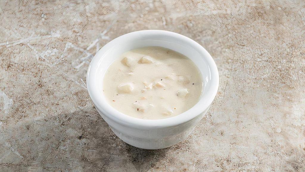 Cup Of New England Clam Chowder · Our famous clam chowder, made with clams, potatoes, celery, onion & bacon.