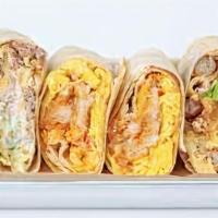 Mexican Breakfast Burrito · Scrambled eggs, bacon, sausage, avocado, hash browns, pico de gallo, cheddar cheese, and bla...