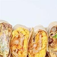 Classic Breakfast Burrito · Scrambled eggs, hash browns, and cheddar cheese wrapped in a flour tortilla. Served with a s...