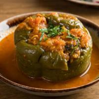 Stuffed Pepper Dinner · Green pepper stuffed with ground lamb, rice, and herbs; slowly simmered with light tomato sa...