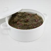 Ghourmeh Sabzi (Lunch) · Parsley and scallions simmered with chunks of beef, red kidney beans, and dried lemon. Serve...