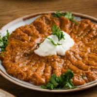 Kashk-Bademjan Dinner · Cooked eggplant in our homemade tomato sauce topped with yogurt.