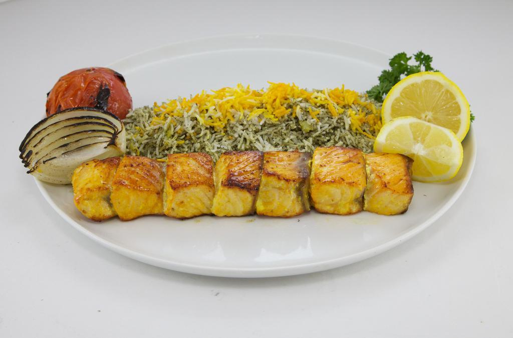 Shrimp Kebob Dinner · Marinated shrimp grilled on a skewer. Served with dilled rice, grilled onion, and tomato.