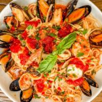 Pasta Pescatore · Shrimp, mussels, clams and calamari in a roasted garlic marinara over linguine.