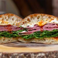 The Strega · Spicy salami with ricotta, arugula and Marks hot honey.