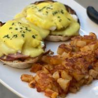 Classic Eggs Benedict · Two poached eggs served on a toasted English muffin with Canadian bacon and our classic holl...