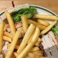 Turkey Club Sandwich · Comes with crispy bacon, lettuce and tomato. Served with French fries or potato salad, pickl...