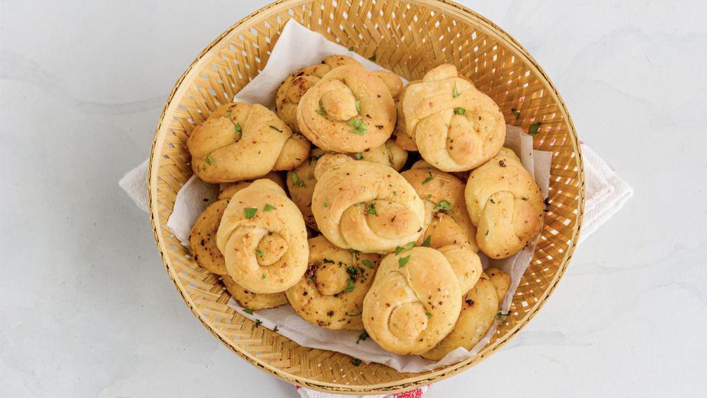 Garlic Knots · Bread, topped with garlic & olive oil or butter, herb seasoning, baked to perfection. Melts in your mouth and arouses the taste buds.