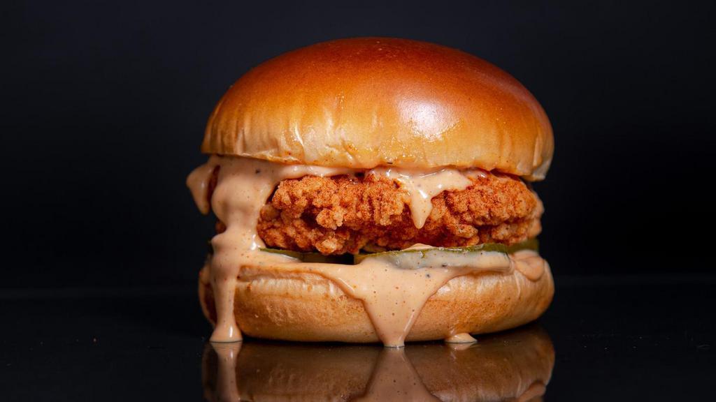 The Classic Sandwich · Cornflake Crusted Chicken Breast seasoned in our signature spice blend in between a toasted brioche bun with pickles, and classic sauce.
