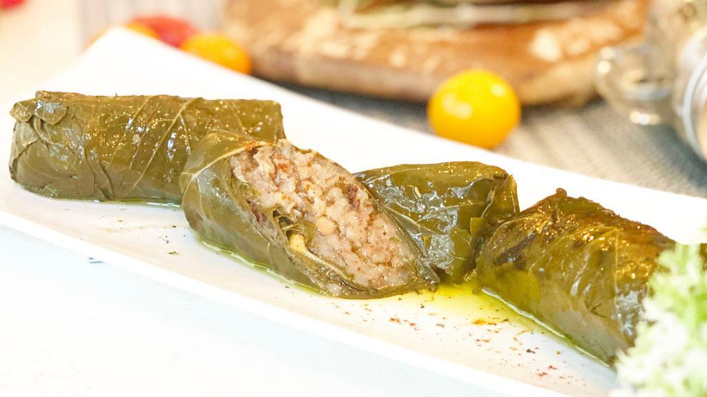 Stuffed Grape Leaves · Vegetarian, gluten free. Grape leaves stuffed with our mixture of rice, onions, pine kernels, and mixed herbs.