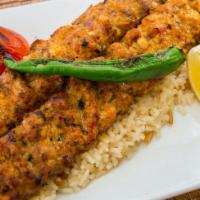 Chicken Adana · Finely chopped chicken seasoned with spices and herbs, charcoal grilled on.
