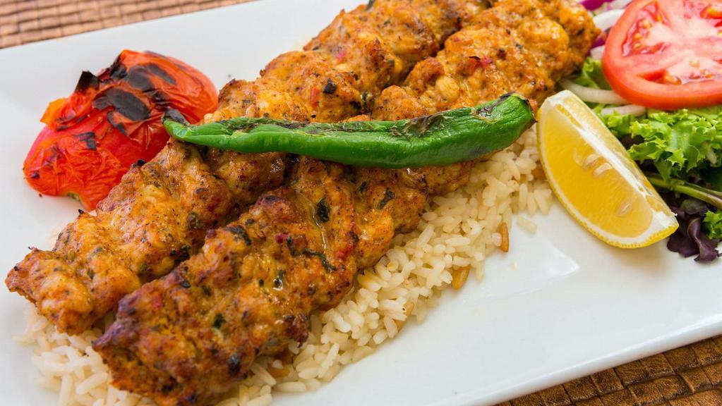 Chicken Adana · Finely chopped chicken seasoned with spices and herbs, charcoal grilled on.