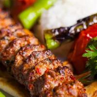 Beef And Lamb Adana · Slightly seasoned hand- chopped beef and lamb flavored with red bell peppers. (Served in two...