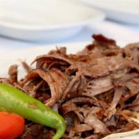 Classic Gyro (Doner) · Thin sliced lamb served over Turkish rice, lettuce, red cabbage.