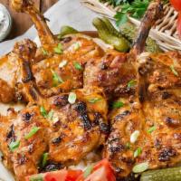 Chicken Chops · Char-grilled chicken leg and thigh with rice and vegetables.